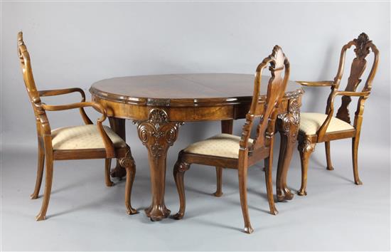 An Edwardian Queen Anne revival walnut extending dining table and set of 8 matching dining chairs table extends to 9ft x 3ft 8in.